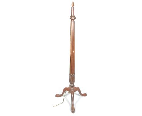 A mahogany standard lamp, the gadrooned stem above stylised leaf and tripod base, on cabriole legs, fitted for electricity - 