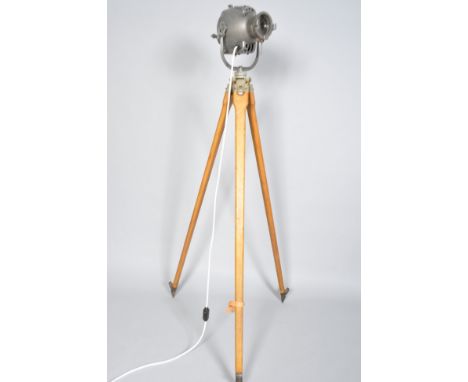 A retro vintage spot light/theatre lamp on beech tripod stand
