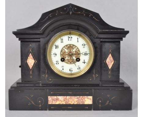 A Victorian slate mantle clock, of arched rectangular form the cream dial with pierced gilt metal and black handle on plinth 