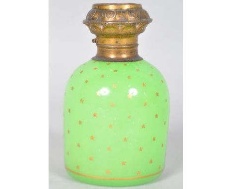 A 19th century green opaline glass scent bottle, of cylindrical form, the gilt metal mount incorporating an architectural pri