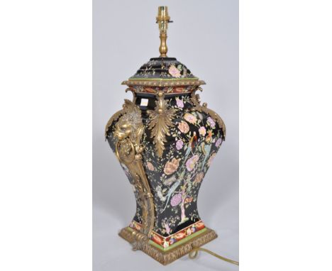 A Chinese porcelain famille noir style brass mounted lampbase, of baluster square section painted and printed with exotic bir