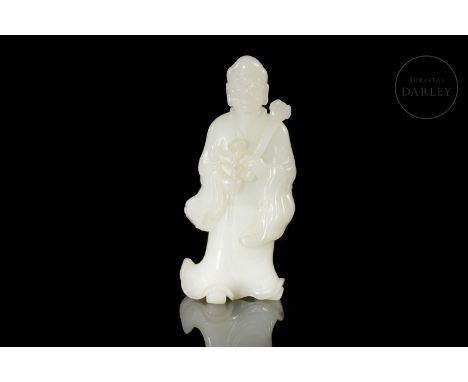 Beautiful carved jade figure of white, milky and shiny color. It shows the representation of a Luohan, with a bulging head an