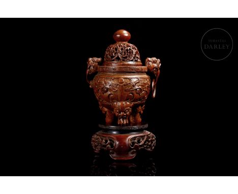 Censer of carved bamboo wood. Arranged on three large feet in the shape of a mythical beast, with an enraged look and open ja