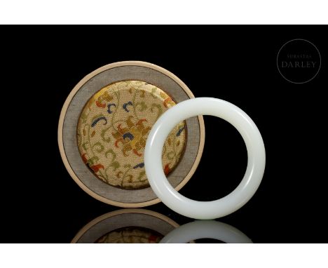Heitan White Jade Slave, Qing dynastyA rigidly shaped, rounded-edged bangle, carved in a beautiful white jade, with a soft, m