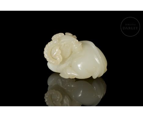 Light-coloured jade carved in one piece. It shows the image of a ram, with an intimidating expression, large open eyes, a wid