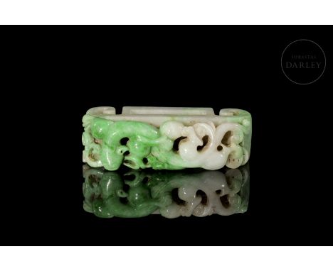 Two-coloured jadeite with intense shades of green and white. Slightly curved rectangular, it shows on the front an elongated 