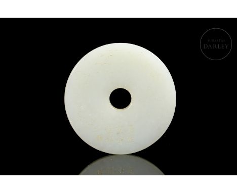 Beautiful Hetian white jade disk carved in the form of a “Bi” with rounded edges and a central circular hole. Decorated with 