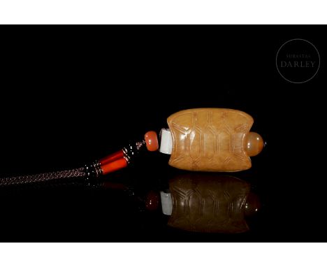 Carved jade ‘Turtle’ pendant, Qing dynastyA small jade pendant with a reddish-golden hue. It has a slightly oval shape, trimm
