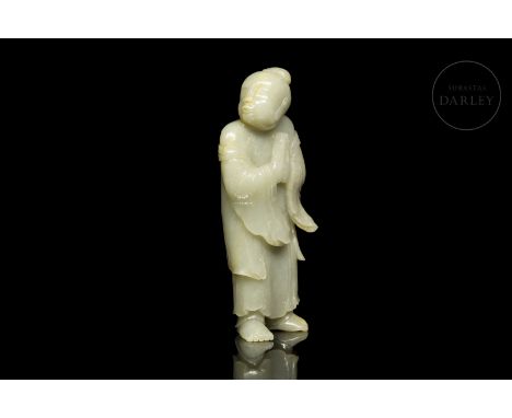 Light toned jade carved in one piece. It shows an upright monk, with his legs slightly open forming a subtle contrapposto. Th