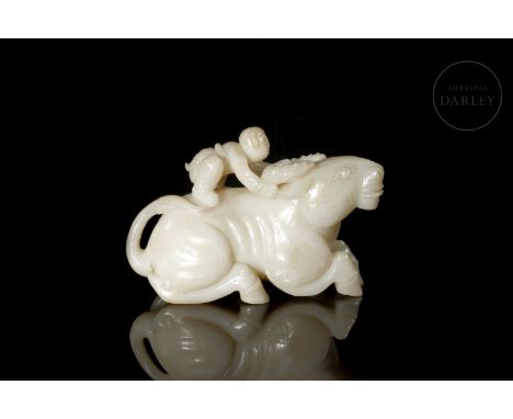 Jade carved in a single light-coloured piece. It shows a large ox, with a friendly gaze and serene expression, standing on it