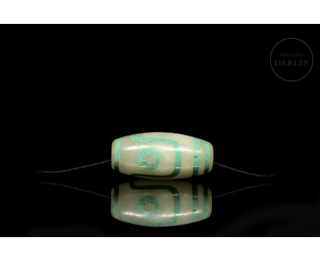 Jade ‘Dzi’ bead with turquoise, Tang dynastyAn antique turquoise-inlaid jade bead with eye-pattern and border decoration. Car