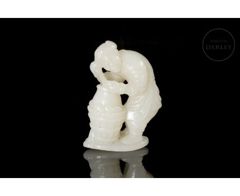 A masterfully carved white jade. It shows the image of an elderly man, as indicated by the wrinkles on his face, dressed in t