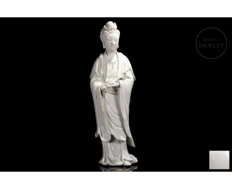 Beautiful figurine of “Guanyin” made of ceramic modeled and glazed in a brilliant white. It shows the deity in hieratic posit