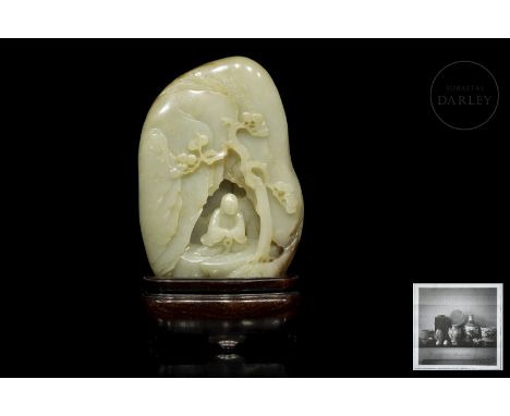 A jade figure carved in the shape of a mountain and a cave with a 'bodhisattva' inside, next to a tree. The reverse is also c