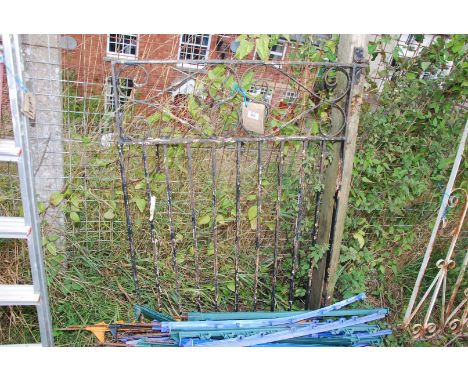 A garden gate with scroll effect and hanging post, 31" wide x 42" high.