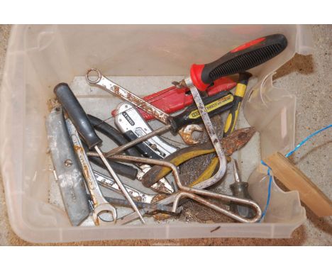A box of tools to include: pliers, Stanley knife, etc.
