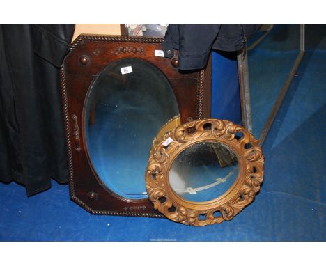 A convex mirror and an oak framed BP mirror.