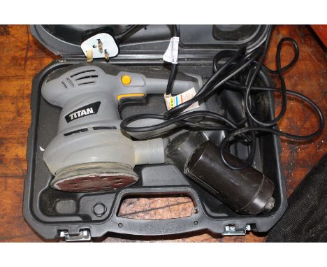 A "Titan" circular sander (cases).