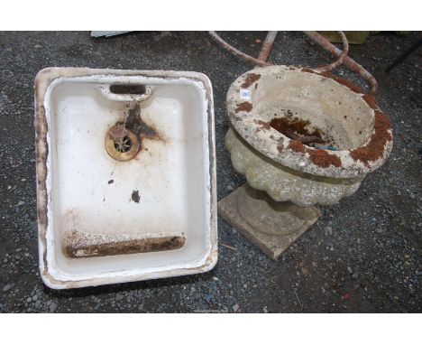 A glazed sink, 50" x 18" x 8" and a concrete circular planter, 16" diameter x 15 1/2" high.