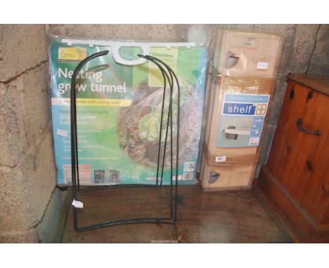 A netting grow tunnel (3.1 mm x .5 mm) and a shelf unit.