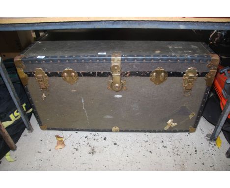 A large metal bound trunk with candle holder, etc  40" wide x 20" deep x 21" high.