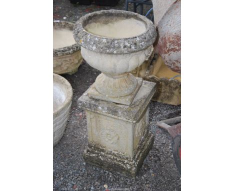 A "Stanford stone" planter on a column, 14 1/2" diameter x 31 1/2" high.