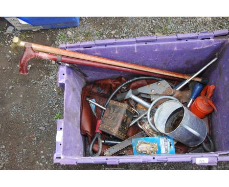 A plastic box containing a "Convac" 3000, a galvanized watering can, wire rope, walking stick, small tools. 