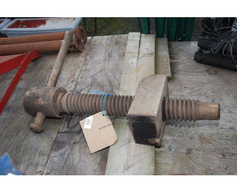 A vintage wooden screw.