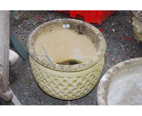 A "Sherston-earl stone" circular planter, 16" diameter x 13 deep,