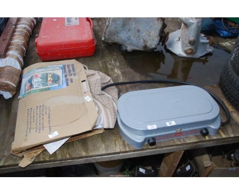 A portable camping stove and camping shelf unit.