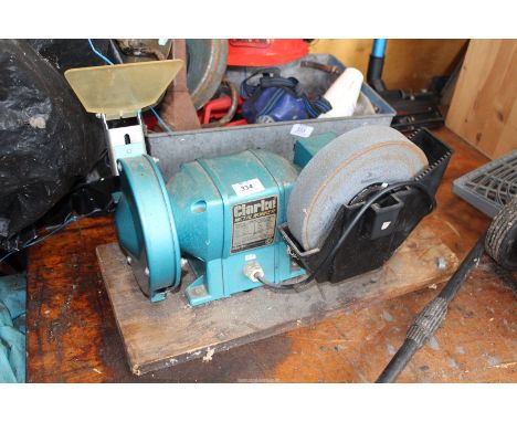 A "Clarke" metal working bench Grinder.