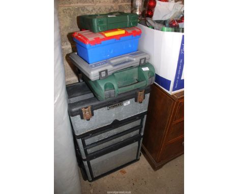A "Stanley" tool box unit plus other empty cases.