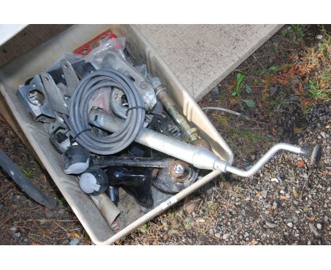A plastic tray containing trailer jockey wheel (no wheel), tractor draw-bar ball hitch, etc.