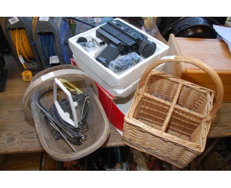 A bottle basket for four bottles, a trug and an "Eumig" Movie camera.