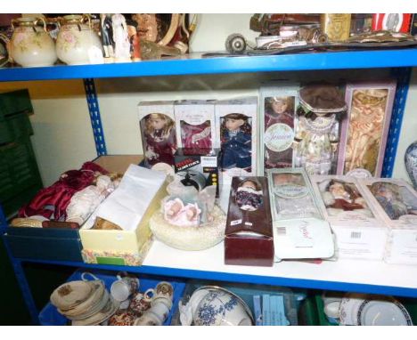 Collection of boxed dolls, alarm clock etc.