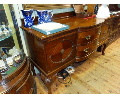 Early 20th Century mahogany two drawer bow front centre and carved panel door cabriole leg sideboard