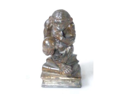 Patinated metal inkwell in the form of a monkey