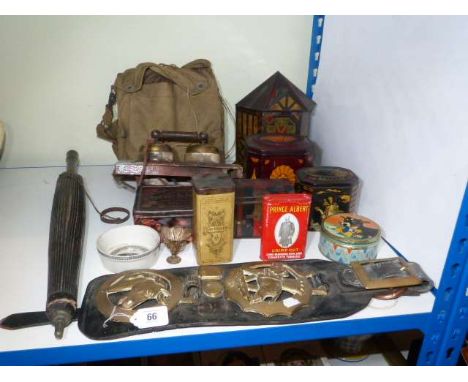 Horse brasses, parasol, vintage tins, gas mask etc.
