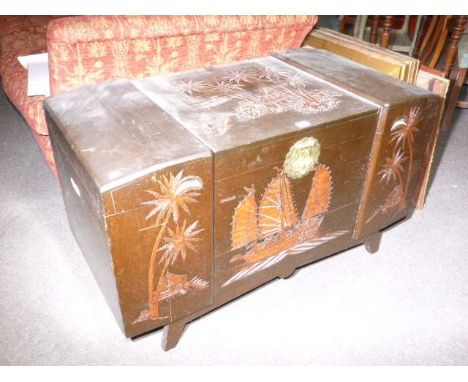 Carved camphorwood trunk and seven pictures