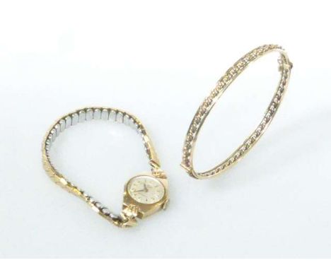 Vintage lady's 9 carat gold Roamer wrist watch, box and papers; and a yellow metal bangle (2)