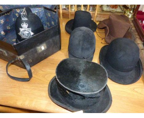 Vintage policeman's helmet, top hat, riding helmet, bowler hat and two others (6)