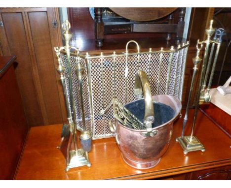 Small brass firescreen, two companion stands, copper and brass coal scuttle and trivet