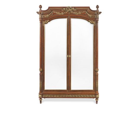 A French late 19th century ormolu mounted mahogany armoirein the Louis XVI styleCirca 1895, the arched cornice with two detac