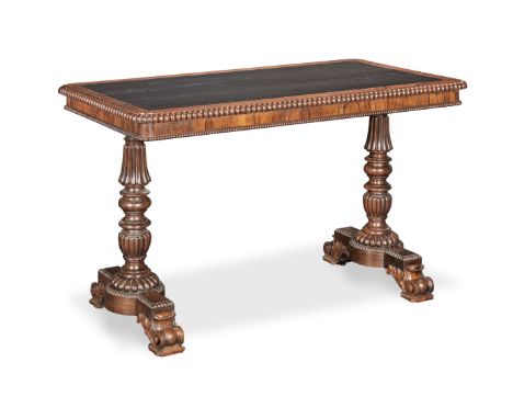 A George IV rosewood writing table attributed to Gillows1825-1830, the rounded rectangular tooled leather inset and gadroon m