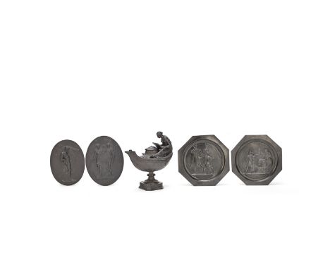 A 19th century Wedgwood black basalt oil lamp together with a pair of black basalt oval figural reliefs and a pair of later b