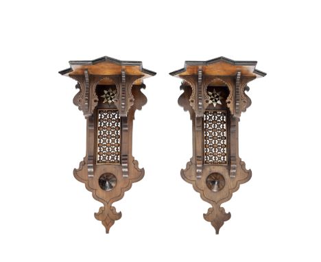 A pair of late 19th century stained wood and mother of pearl and bone inlaid wall bracketsin the Moorish stylethe moulded sta