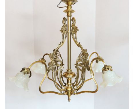An Arts &amp; Crafts brass four light electrolier, with vaseline glass shades, drop 80cm, width 84cm
***CONDITION REPORT***Ve