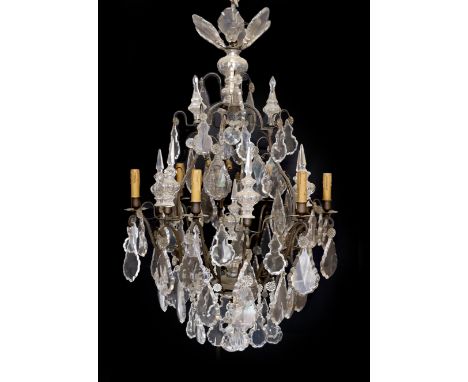 An early 20th century French bronze and cut glass six light chandelier, of particularly ornate design, with spear finials, lo