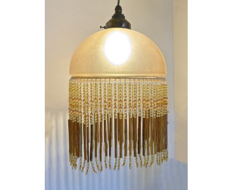 An opaque glass ceiling light with beaded fringe, 35 x 23cm
***CONDITION REPORT***Good condition, recently re-wired.
&nbsp;
