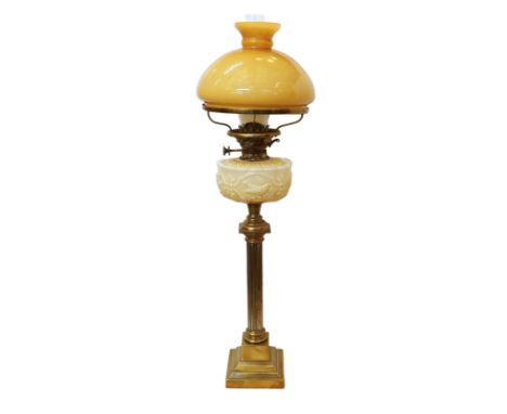 A late Victorian brass oil lamp with opaque coloured glass reservoir, Hinks No.2 duplex mechanism and opaque amber tinted gla